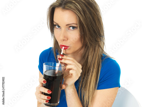 Young Woman Drinking Fizzy Cola Drink