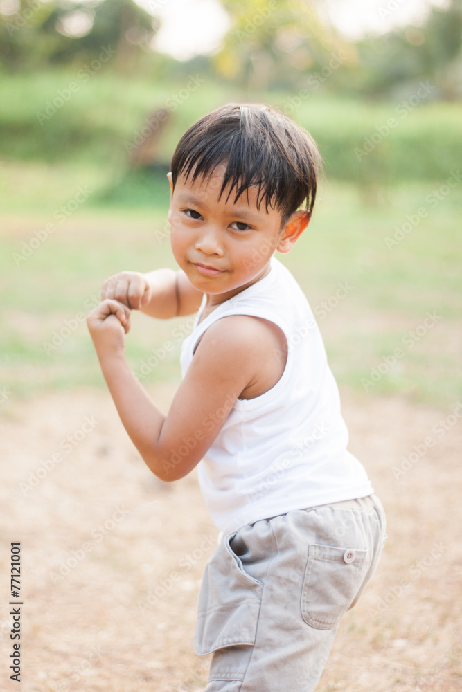 happy young asia boy playing kungfu having fun happy young asia boy playing kungfu having fun