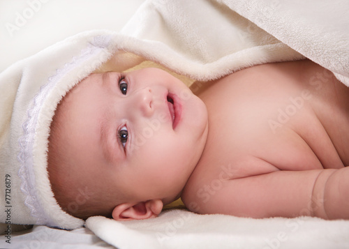 little boy covered with a towel