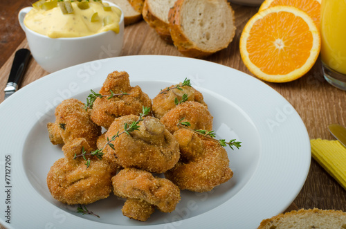 Breaded fried mushrooms with juice photo