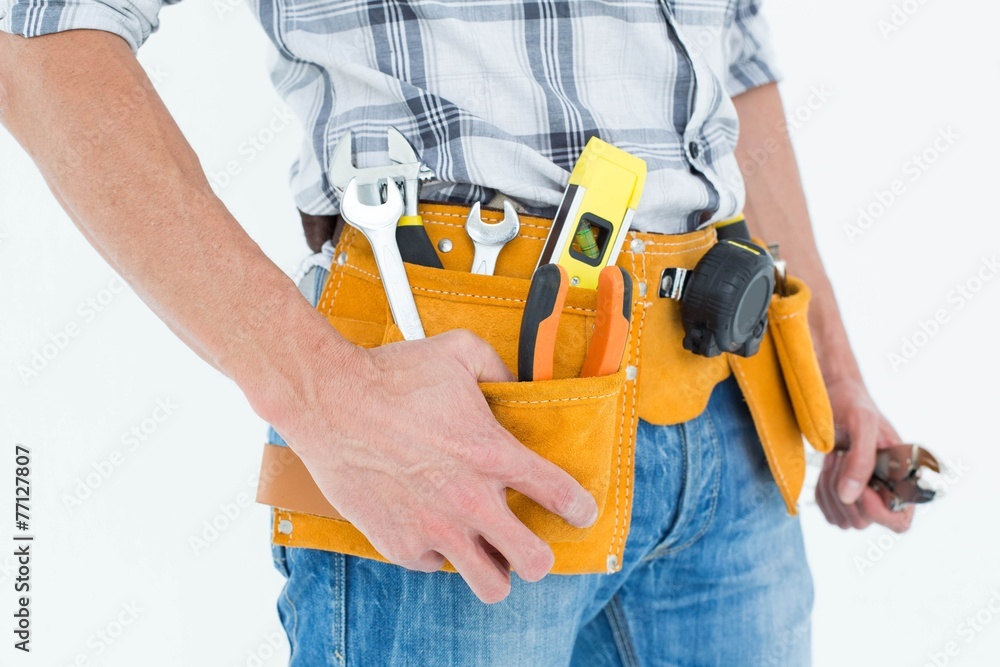 Cropped image of technician with tool belt around waist Cropped image of technician with tool belt around waist