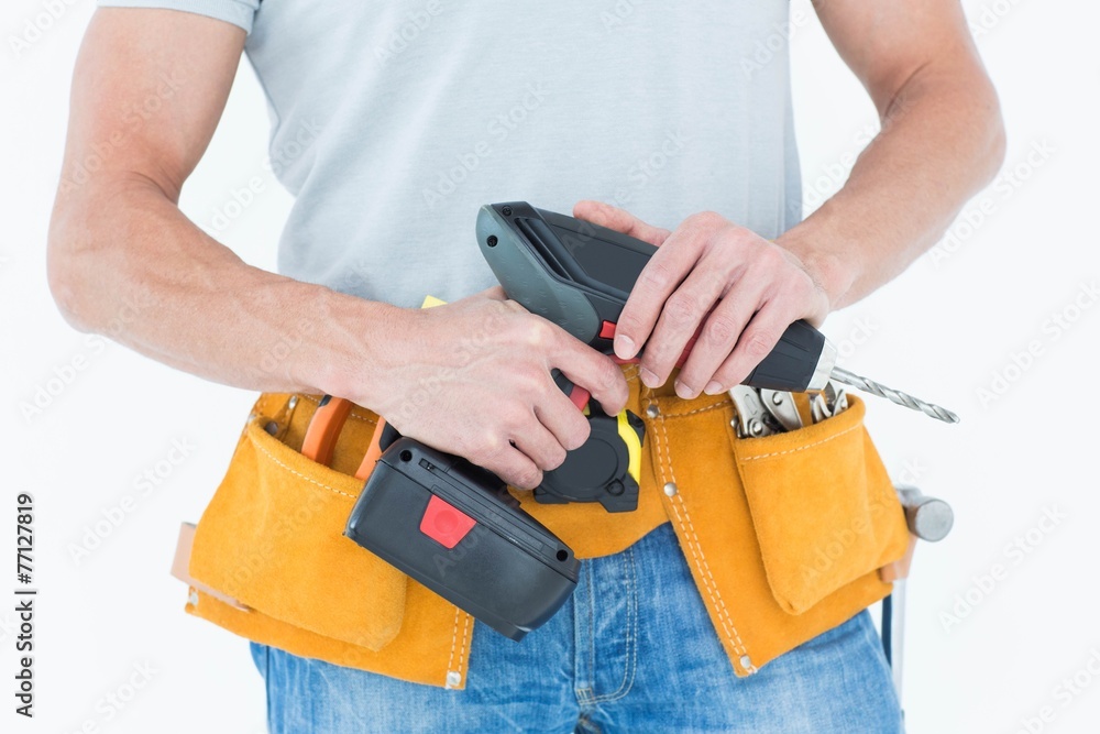 Repairman holding handheld drill