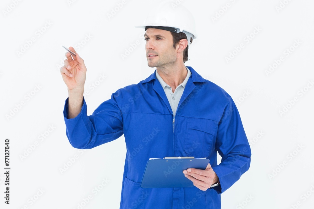Supervisor inspecting while holding clip board Supervisor inspecting while holding clip board