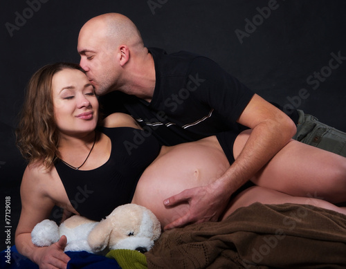 the pregnant woman with her husbend photo