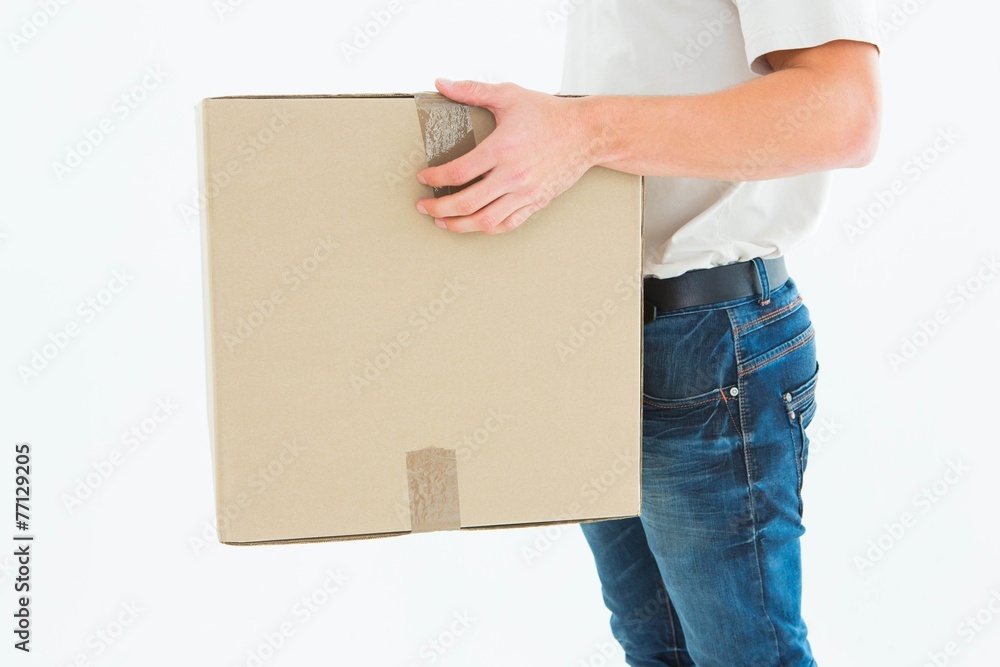Delivery man carrying cardboard box Delivery man carrying cardboard box