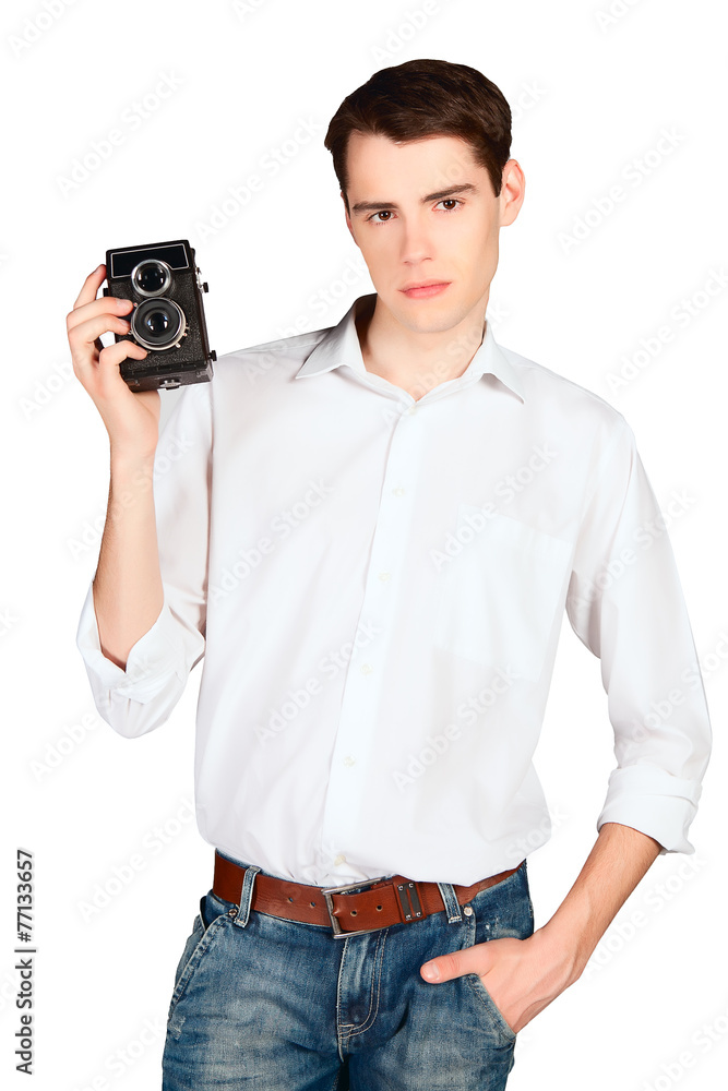 Fototapeta premium young man with retro camera isolated on white