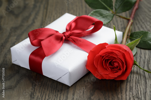present box with ribbon bow and rose