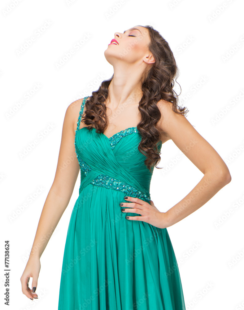 Portrait of young woman in evening green dress