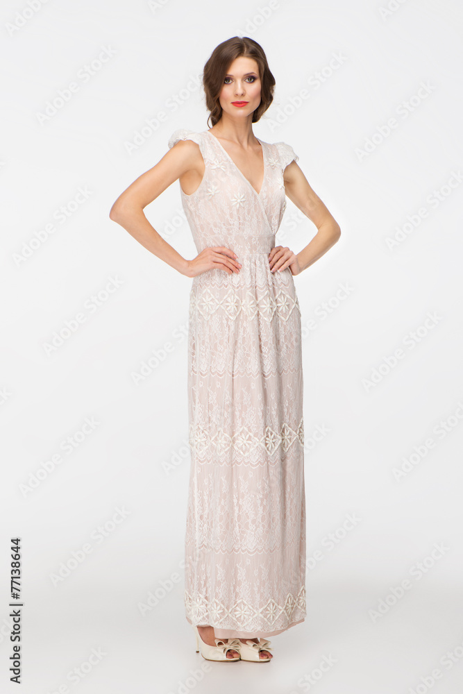 Beautiful young woman wearing white evening dress Beautiful young woman wearing white evening dress