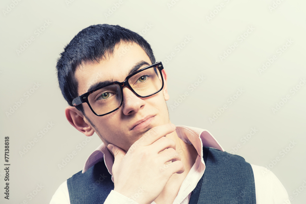 portrait of young business man thinking portrait of young business man thinking