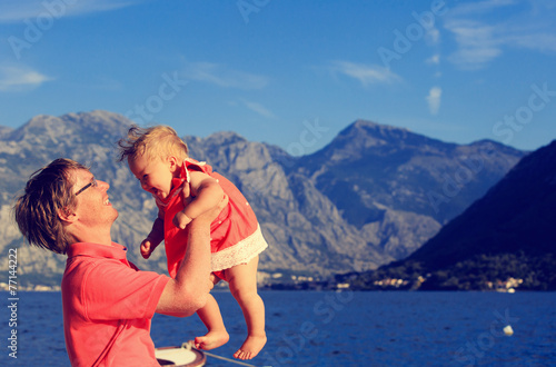 father and little daughter playing on vacation © nadezhda1906