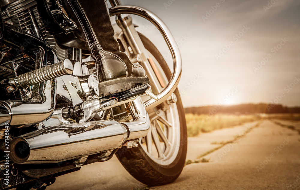 Fototapeta premium Biker girl riding on a motorcycle