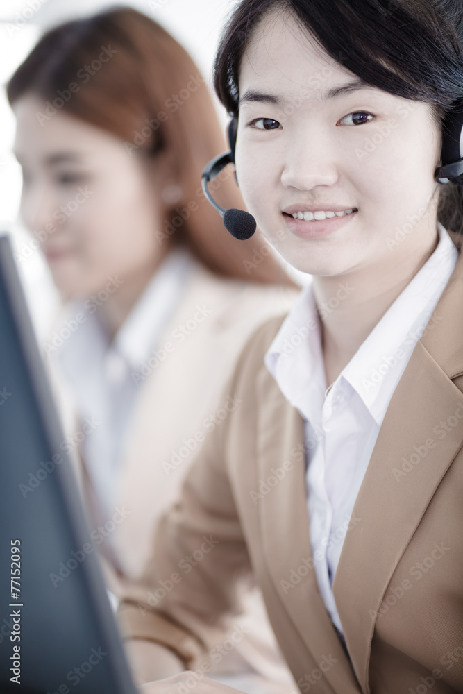 Asian women call center with phone headset Asian women call center with phone headset