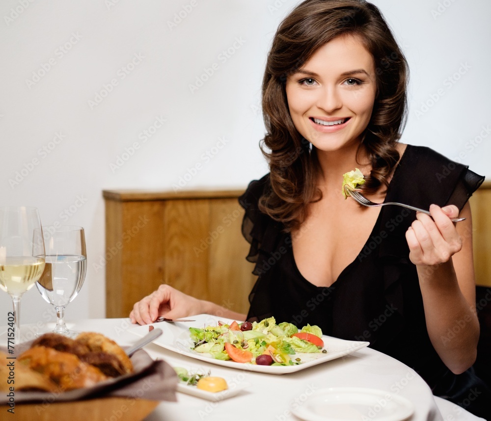 Beautiful young lady alone in restaurant Beautiful young lady alone in restaurant