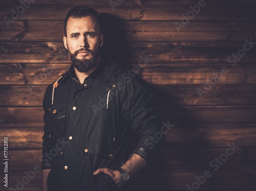 Handsome man with beard  wearing waxed canvas jacket