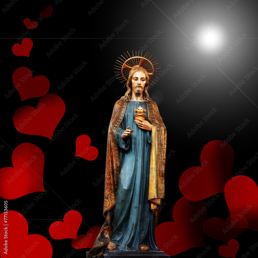 Fototapeta premium jesus christ statue,hearts and black background