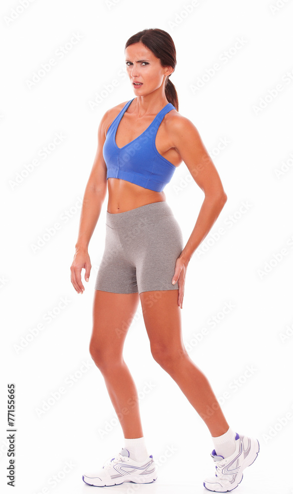 Female athlete suffering painful muscle strain Female athlete suffering painful muscle strain