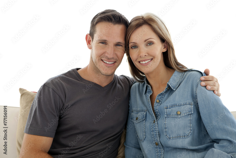 Portrait of a couple in love sitting on a sofa Portrait of a couple in love sitting on a sofa