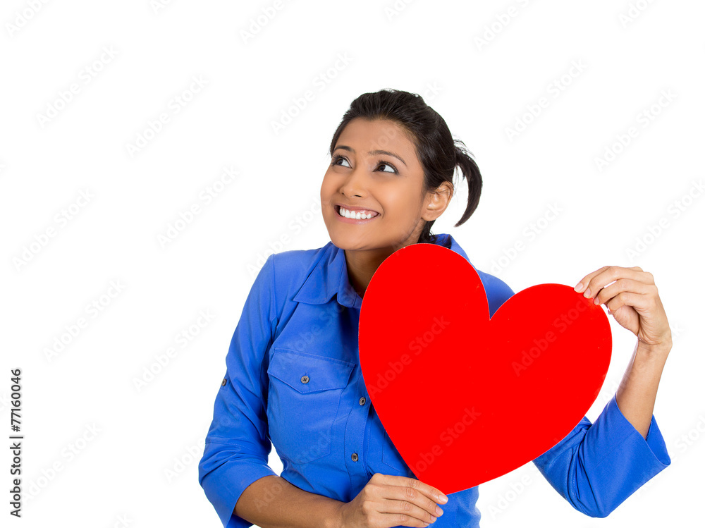 Woman holding heart to chest daydreaming of men in love Woman holding heart to chest daydreaming of men in love