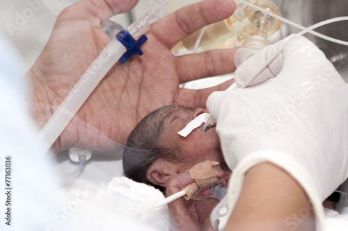 Newborn and hand