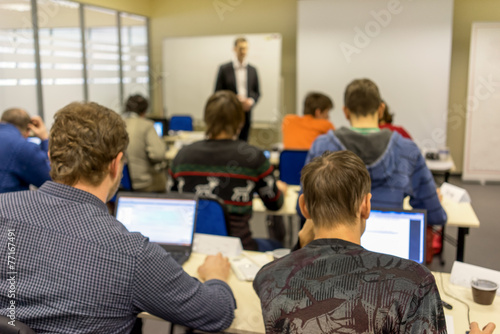 people sitting rear at the computer class