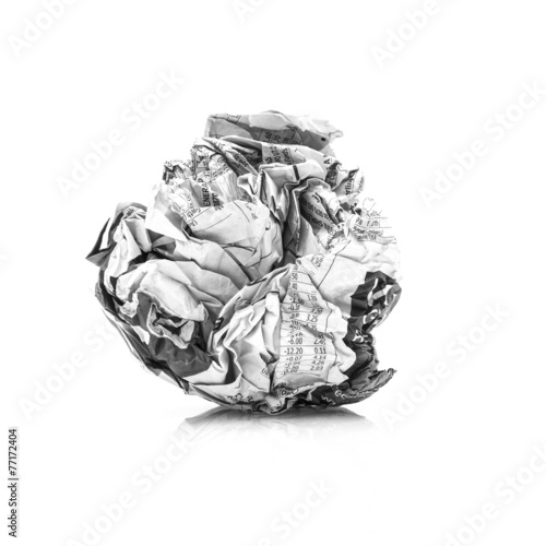 Fotografija A Screwed up piece of Newspaper on ahite background