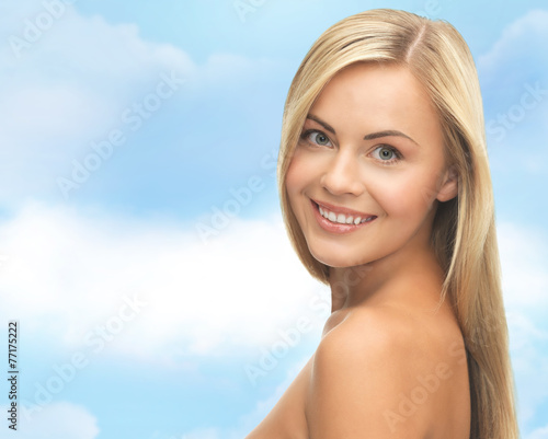 face of beautiful young happy woman with long hair
