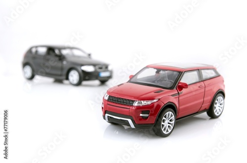 Red and black cars toy set isolated on white background © Proxima Studio