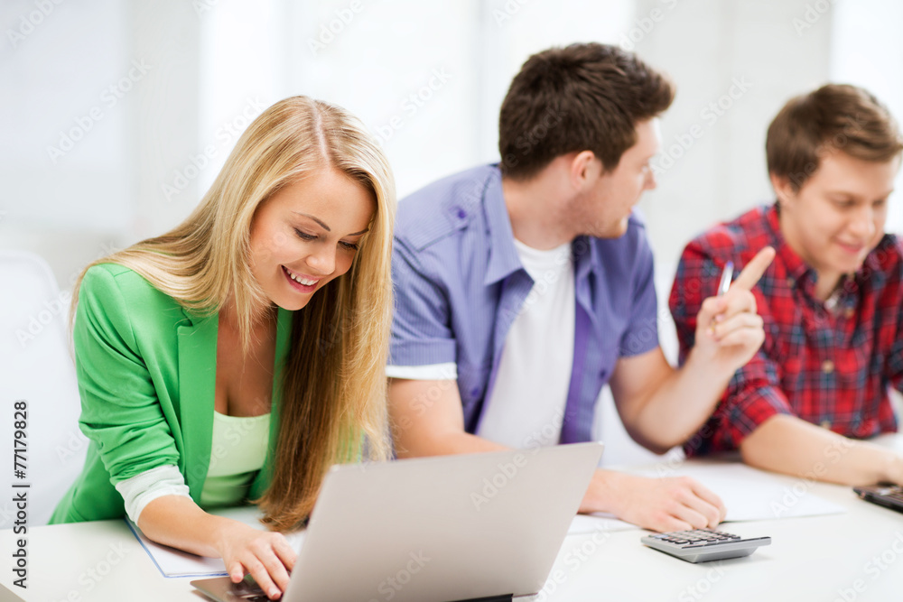 students writing test or exam in lecture at school students writing test or exam in lecture at school