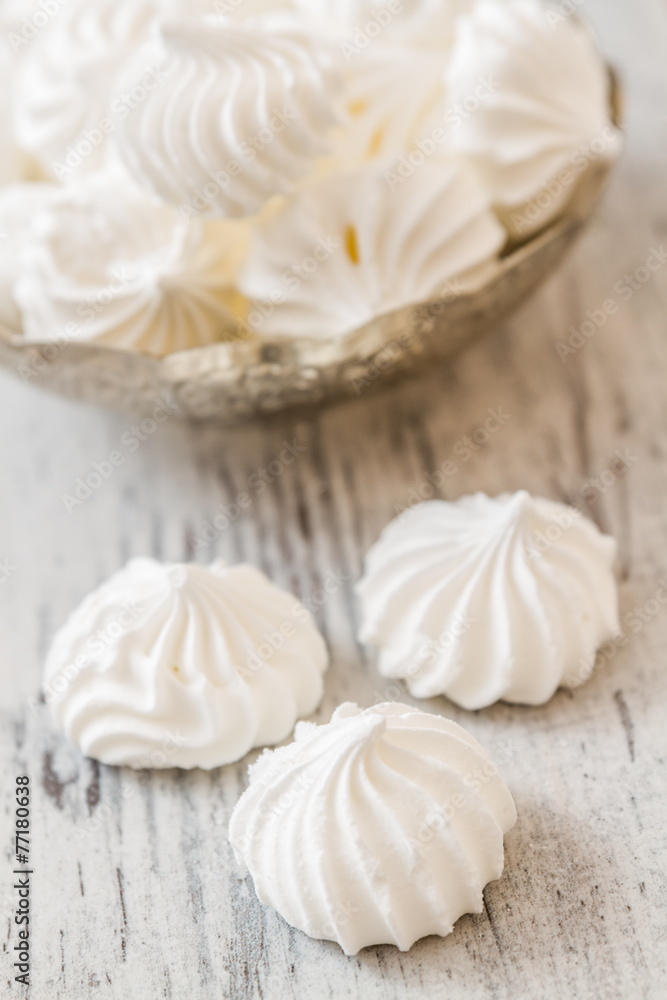 Vanilla meringue cookies on White Wooden Background Vanilla meringue cookies on White Wooden Background