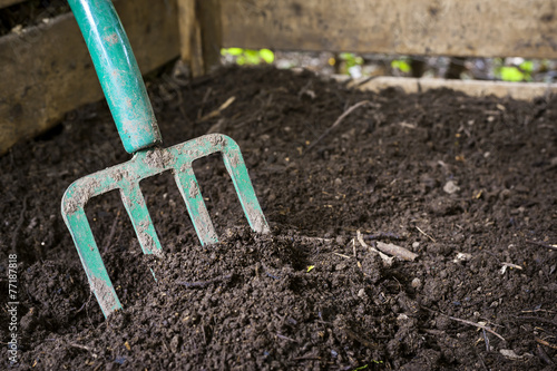 Obraz na płótnie Garden fork turning compost