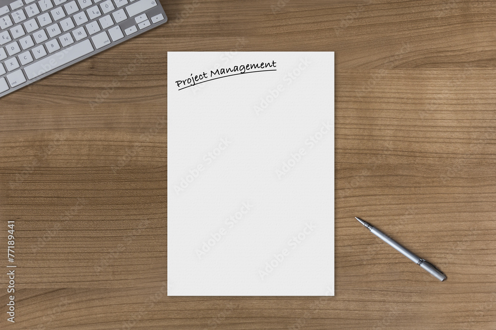 Blank sheet Project Management on a wooden table Blank sheet Project Management on a wooden table
