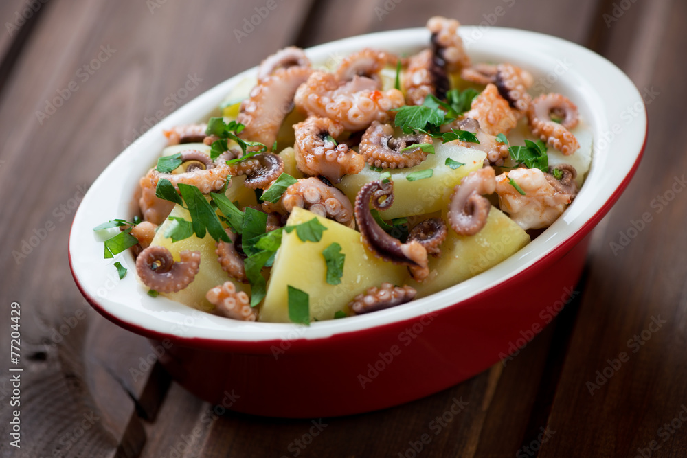 Italian salad with chopped octopus, potato and parsley Italian salad with chopped octopus, potato and parsley