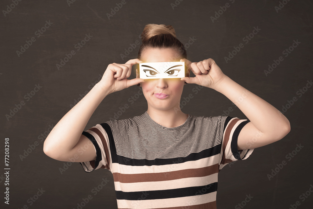 Cool youngster looking with a paper hand drawn eyes Cool youngster looking with a paper hand drawn eyes
