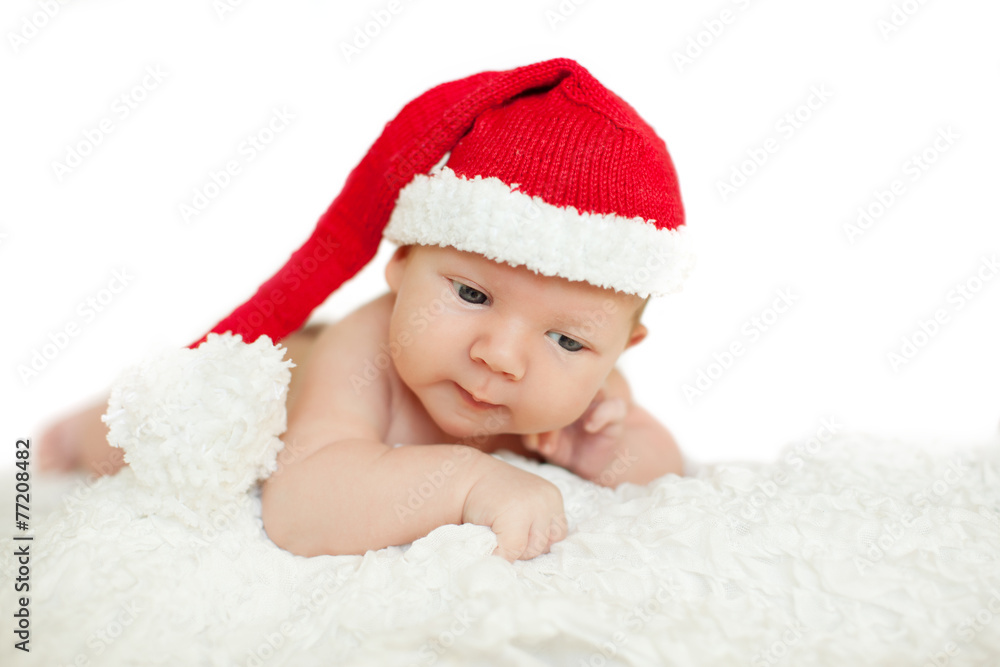 Christmas newborn baby in santa hat. Winter child on winter whit Christmas newborn baby in santa hat. Winter child on winter whit