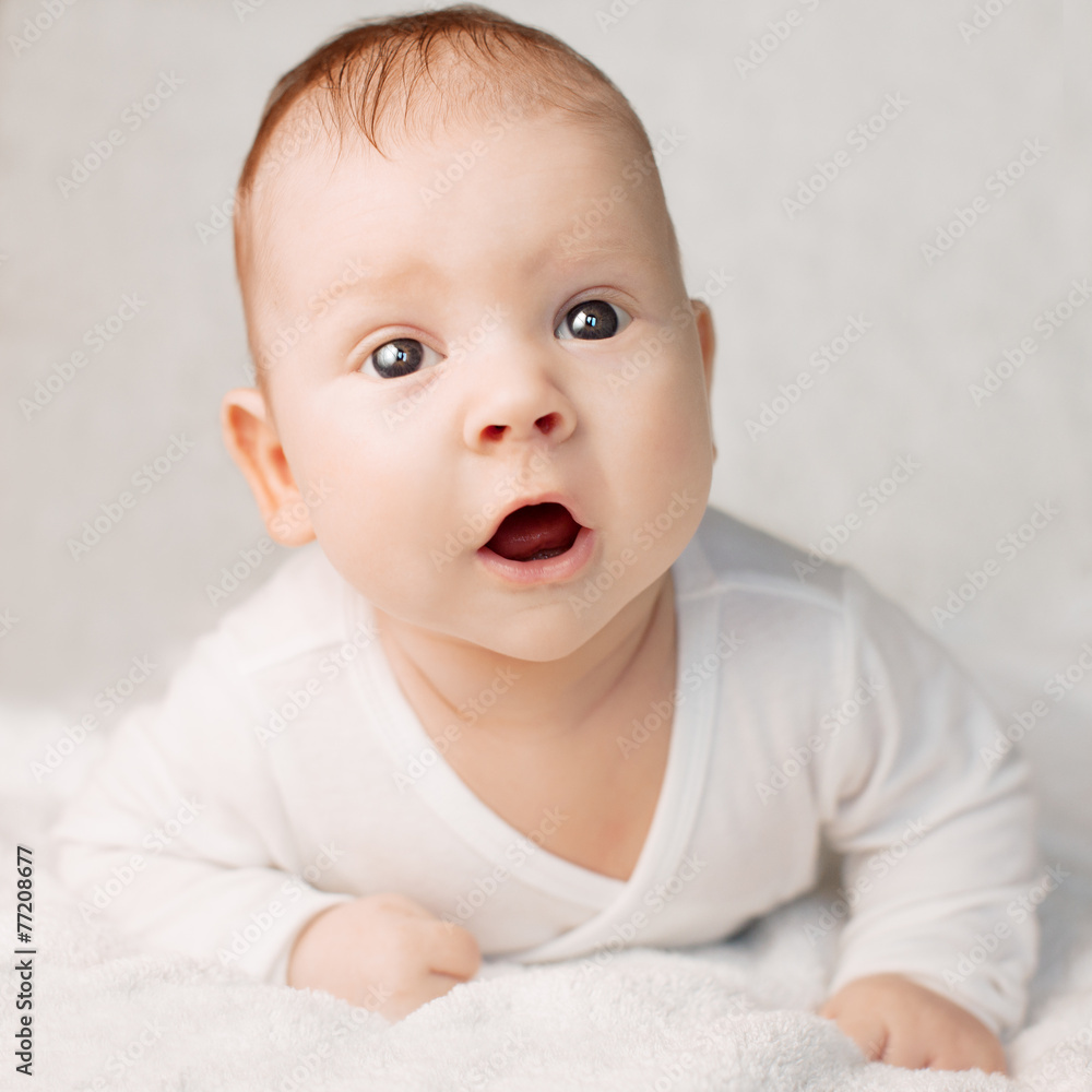 Beautiful cute laughing baby. Boy or girl on white. Little child