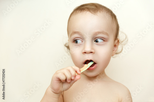 Small boy brushing his teeth