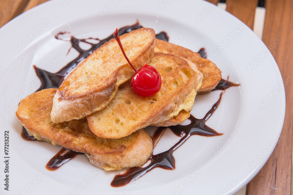 hot french toast with chocolate sauce and cherry