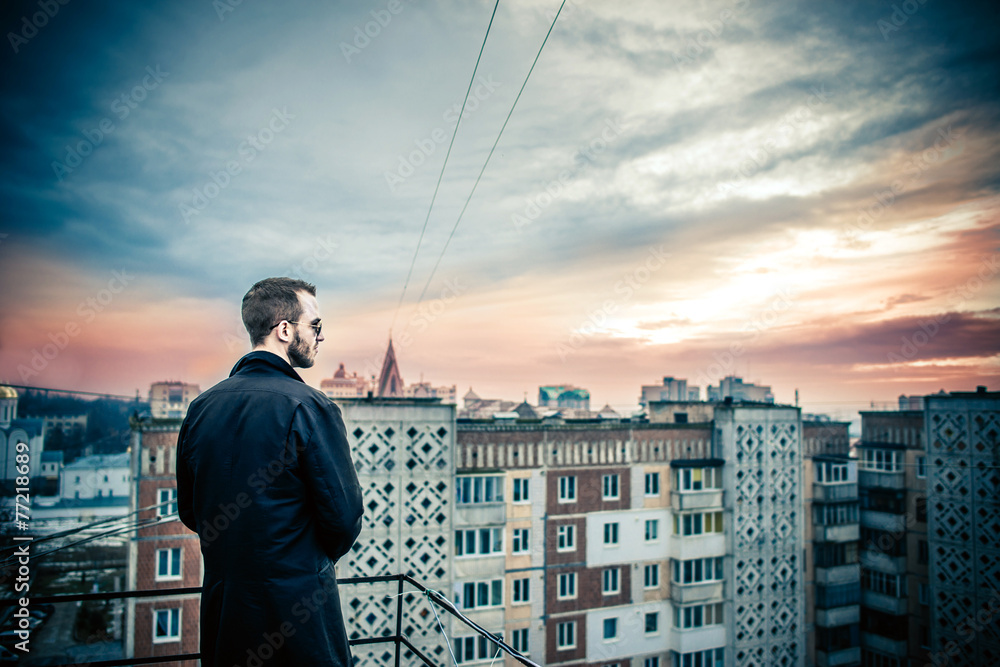 Man on the roof of the high building Man on the roof of the high building