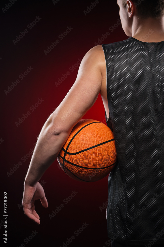 Close up of Caucasian basketball player holding the ball Close up of Caucasian basketball player holding the ball