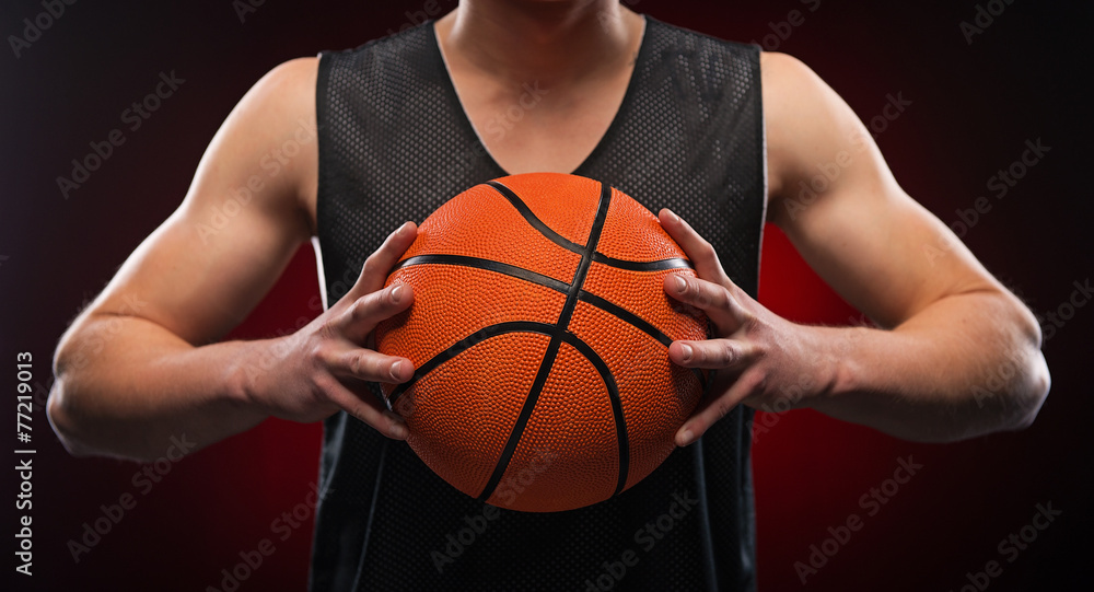 Close up of male basketball athlete gripping the ball Close up of male basketball athlete gripping the ball