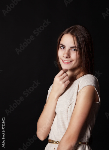 young beautiful smiling girl in a bright dress
