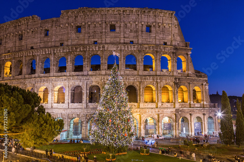 Billede på lærred Colosseum in Rome at Christmas during sunset, Italy