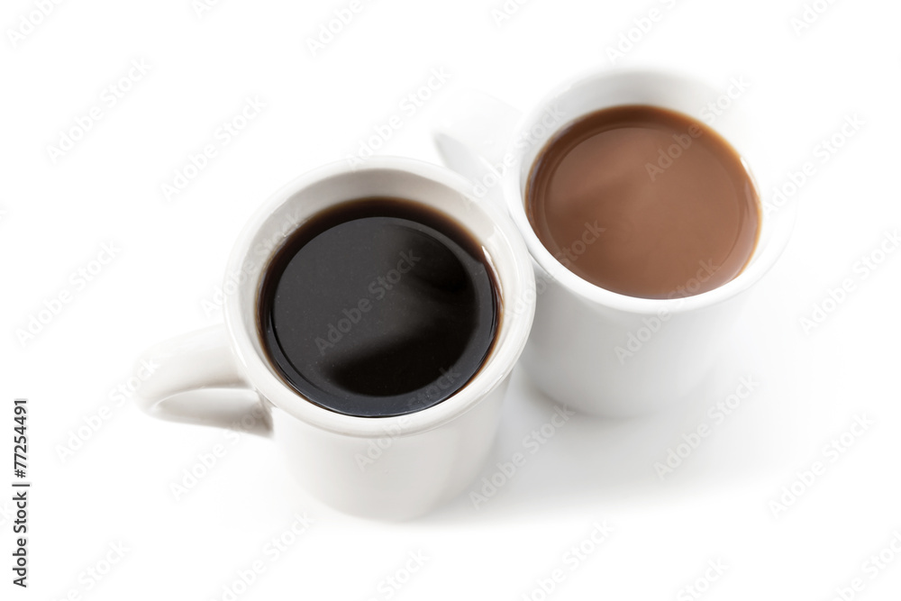 Two cups full of coffee stand on table with shadow Two cups full of coffee stand on table with shadow