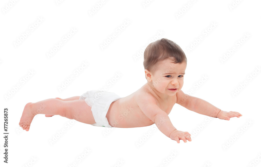Sad six month baby in diaper lying on the floor Sad six month baby in diaper lying on the floor