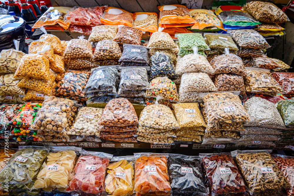 Obraz premium Dried fruits and nuts for sale at Gwangjang Market in Seoul