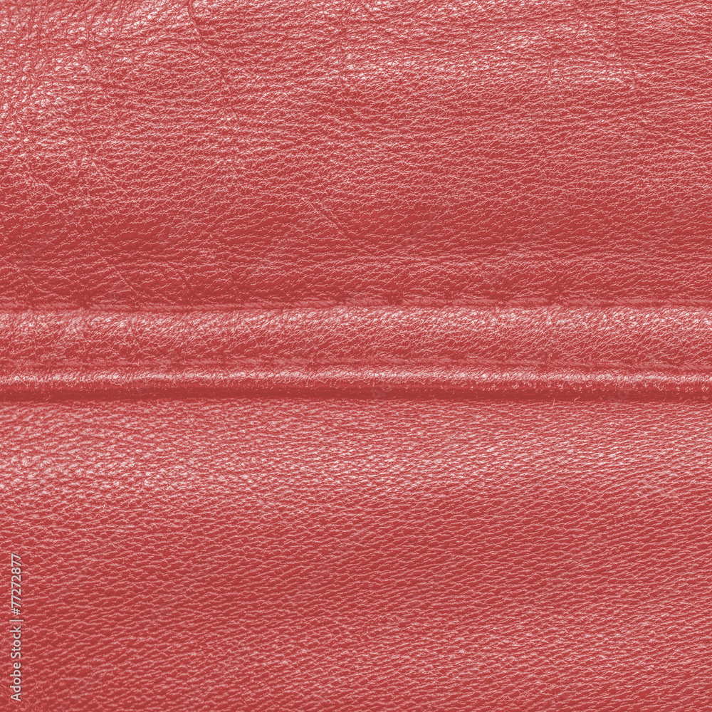 Fototapeta premium red leather texture, seam. Useful as background