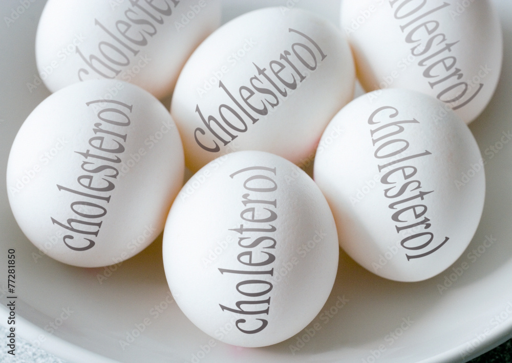 White eggs with Cholesterol text - health and healthy lifestyle