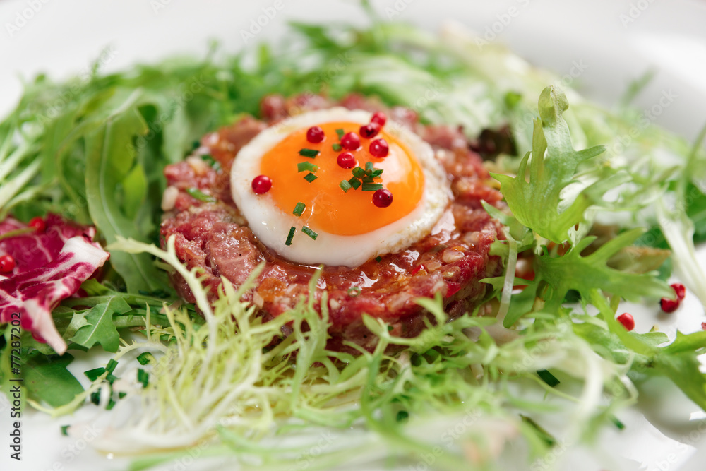 Beef tartare in plate, close-up Beef tartare in plate, close-up