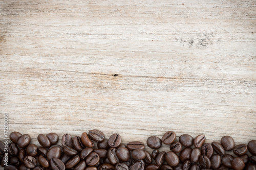 coffee beans on grain wood background